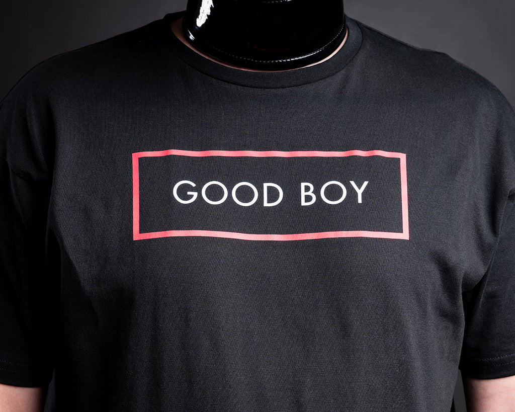 Black t-shirt with good boy printed in white text surrounded by a red box.