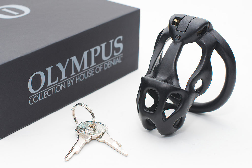 Black Hera chastity device with lock keys and Olympus storage box.