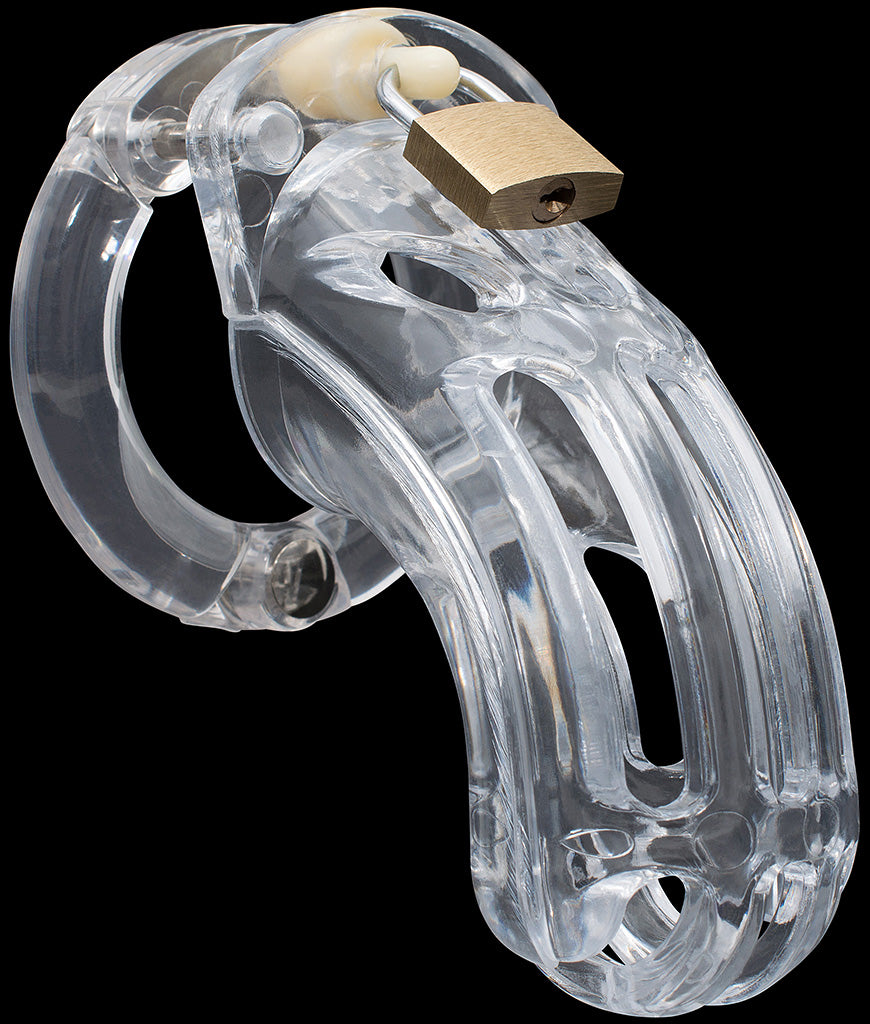 Clear HoD600L male chastity device with a large curved air vent down the front of the cage and a brass padlock attached to a cream coloured central lock pin at the top of the cage. The back ring has a visible metal hinge at the bottom.