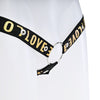 Close up of the black strap with gold love text attached to a metal o-ring.
