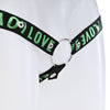 Close up of the black strap with green love text attached to a metal o-ring.
