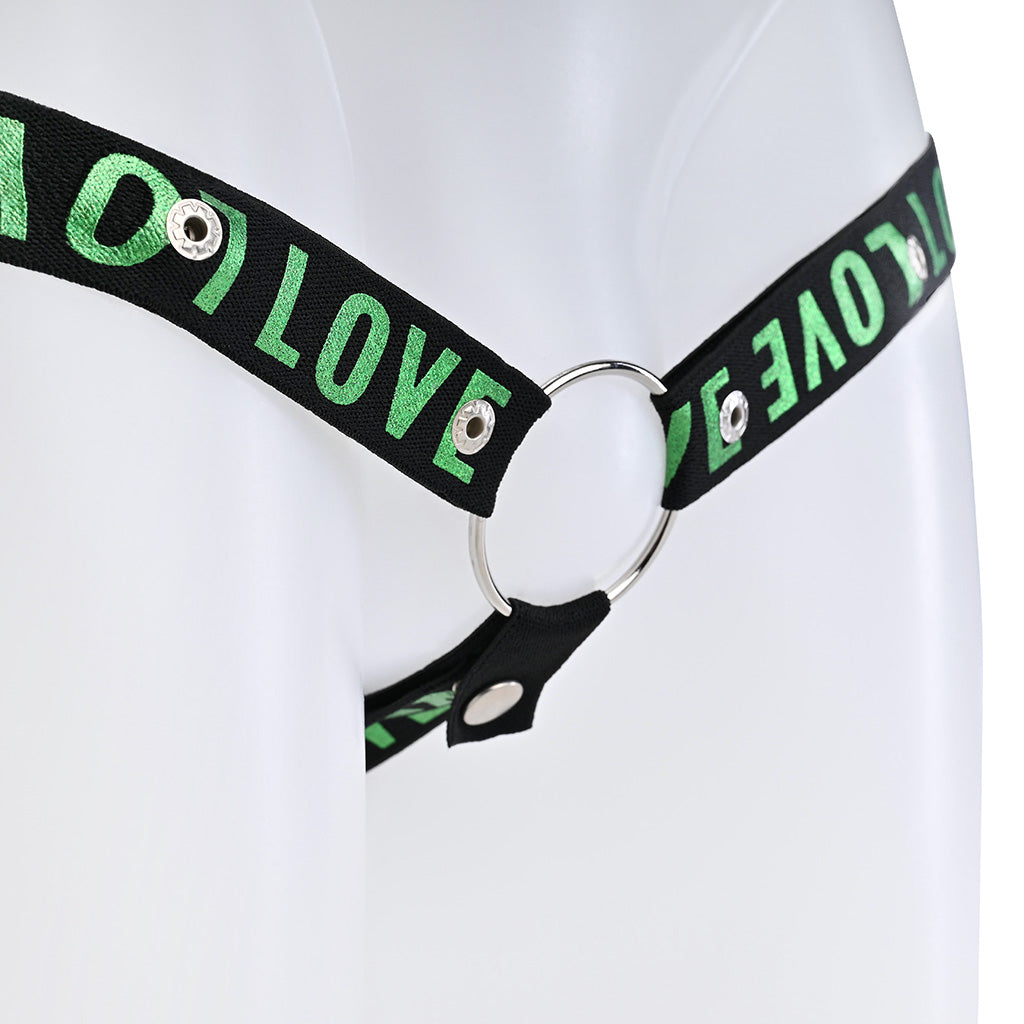 Close up of the black strap with green love text attached to a metal o-ring.