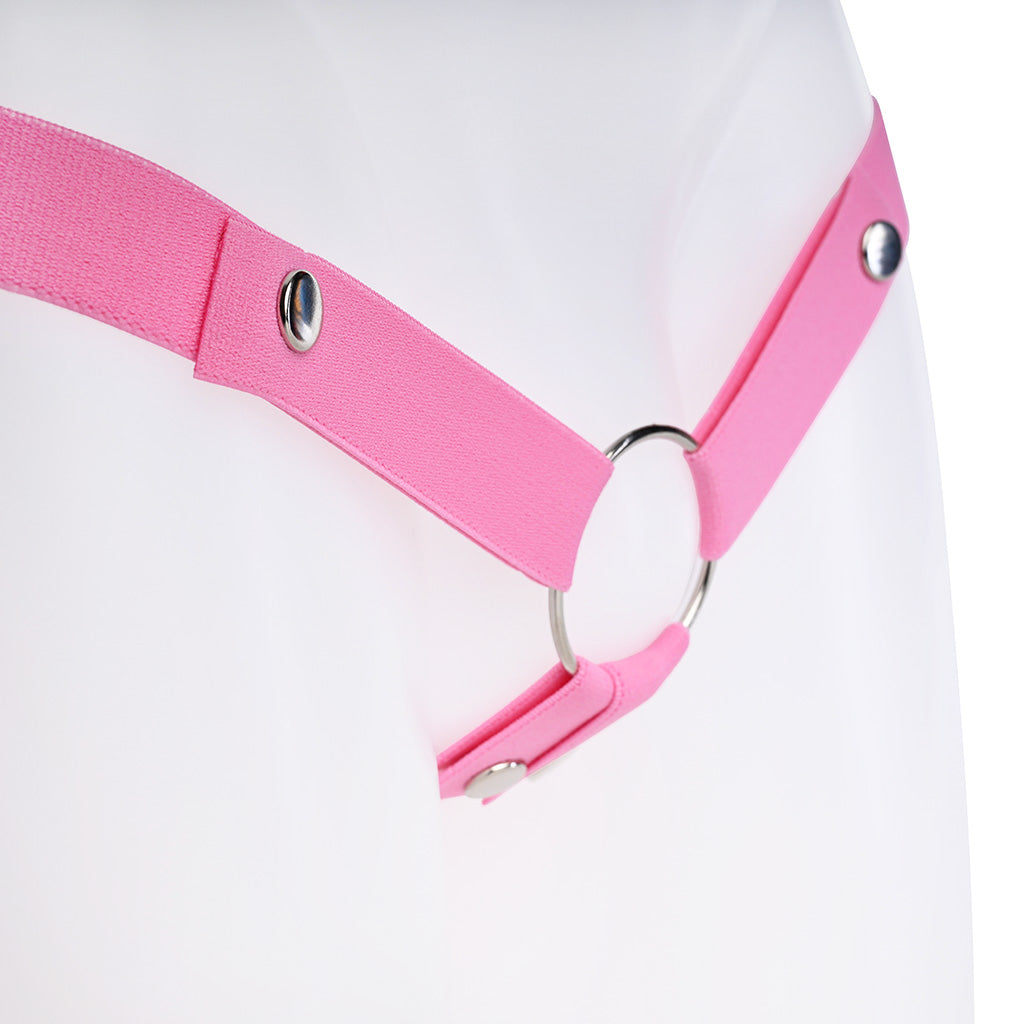 Close up of the 4 way pink strap and how it attaches to a metal back ring.