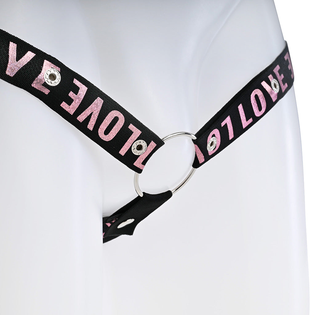 Close up of the black strap with pink love text attached to a metal o-ring.