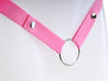 Close up of the popper buttons and metal o-ring on the pink strap.