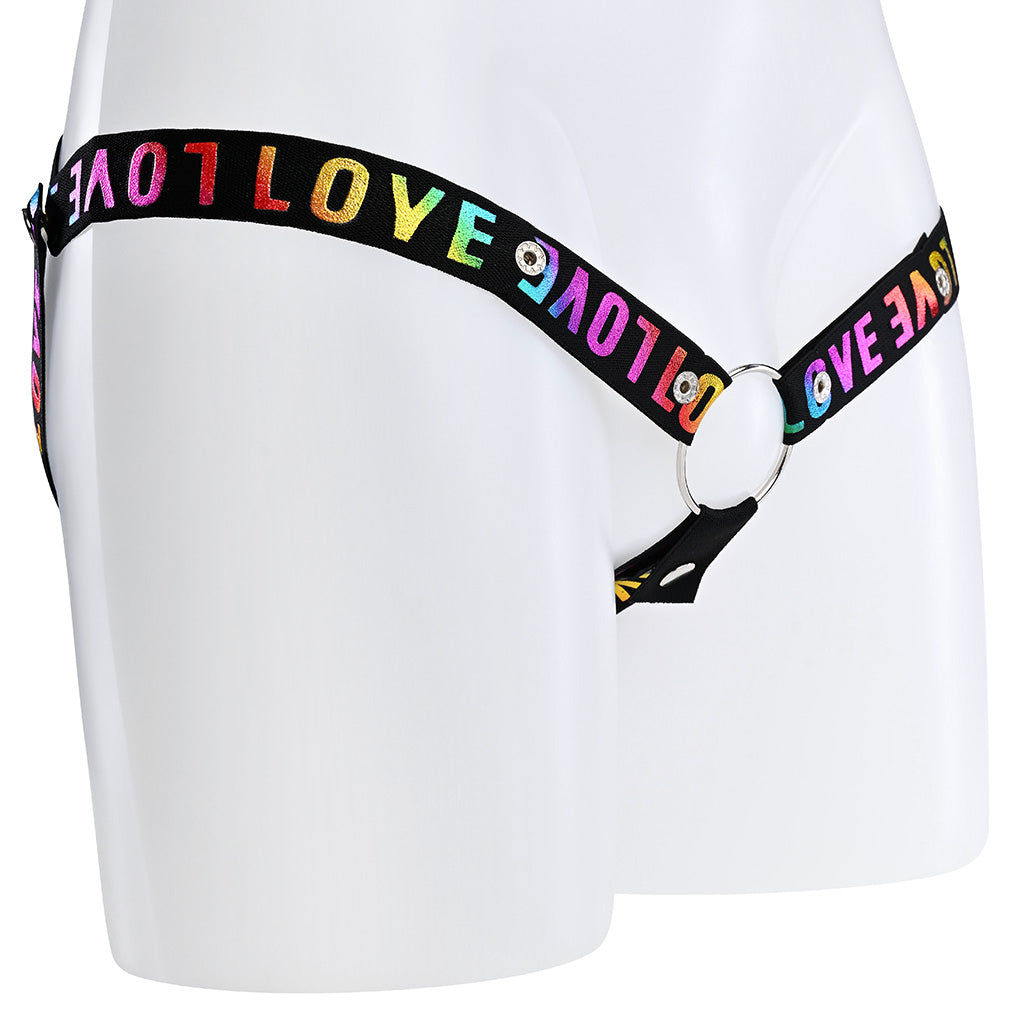 A black elasticated strap with rainbow love wording around it that attaches at 3 different points to a metal o-ring.