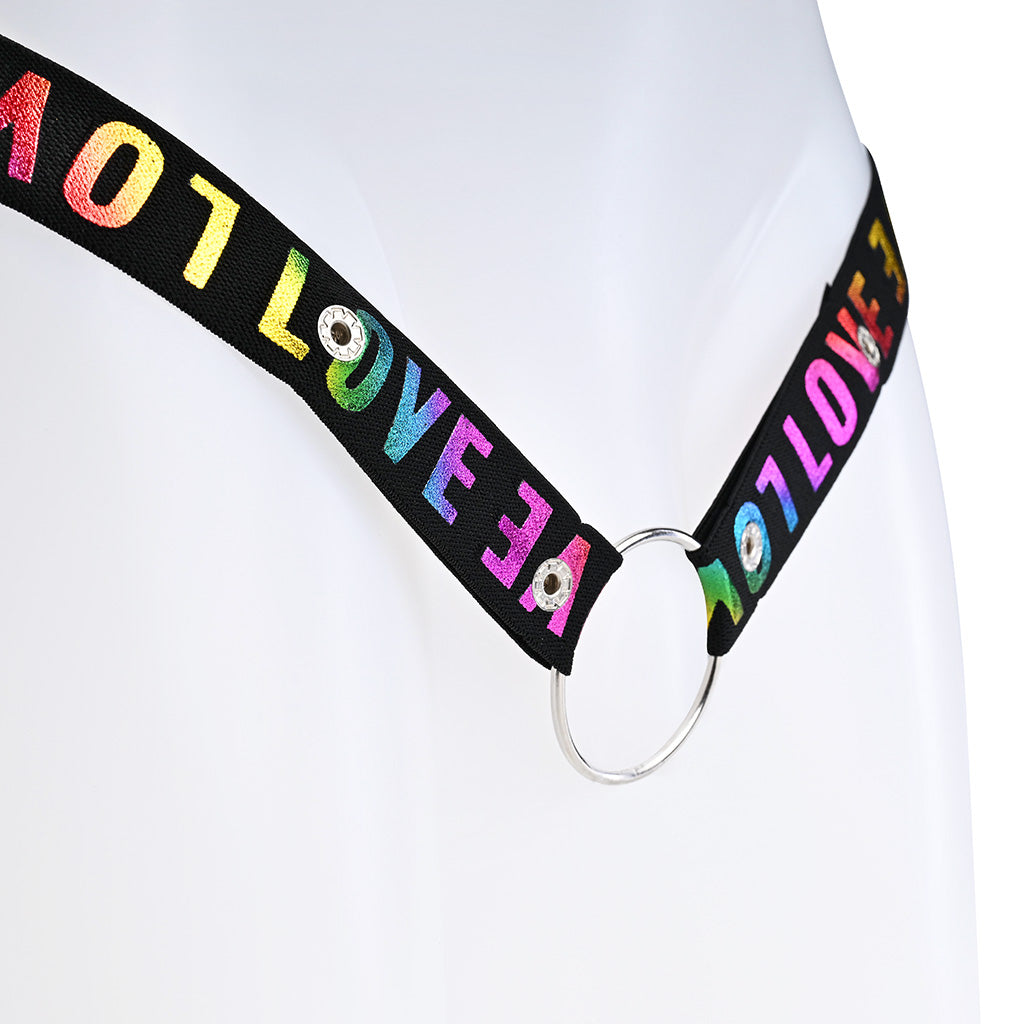 Close up of the poppers and metal o-ring on the black strap with rainbow colour Love around it.