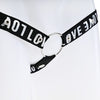 Close up of the black strap with silver love text attached to a metal o-ring.