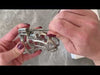 Attaching the standard size S224 cage to the circular back ring then screwing a hexlock screw into the lock hole.