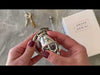 Attaching the large size metal cage with the curved back ring then locking the kit shut with the brass sliding lock.