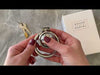 Attaching the extra small sized cage to the circular back ring them locking them shut with the brass lock and keys.